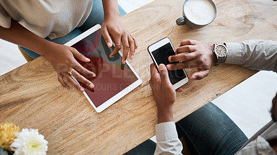 Buy stock photo Hands, tablet and phone with a coffee shop business team working together online closeup from above. Marketing, ecommerce and remote work with a man and woman employee at work in an internet cafe