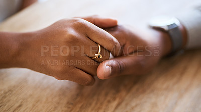 Buy stock photo Holding hands, support and trust with couple and love, solidarity, comfort and care with hands zoom against wood table. Partnership, marriage and relationship, helping hand and commitment closeup.