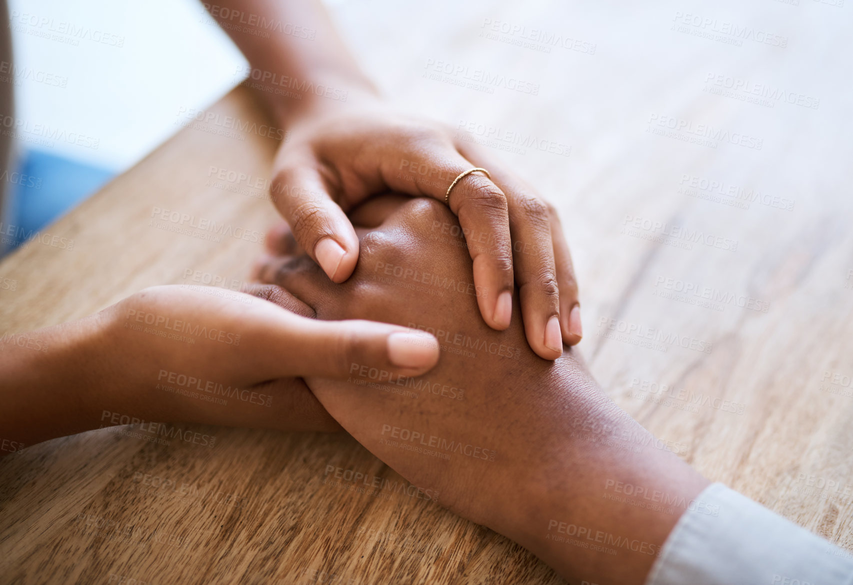 Buy stock photo Holding hands, support and couple by table in closeup for help, care and empathy with hope in home. Black couple, helping hand and love to forgive, consult or comfort for kindness in house with grief