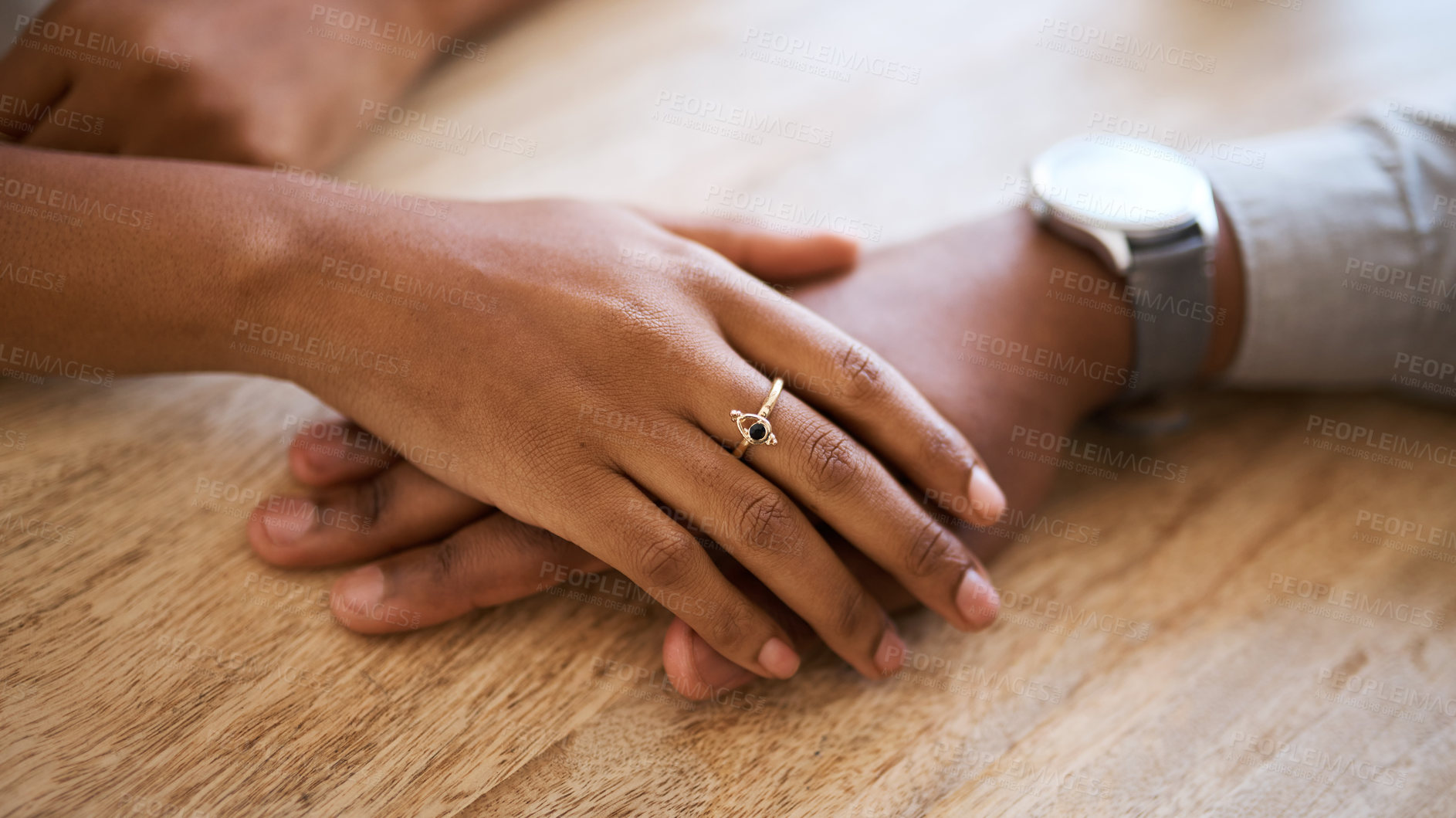 Buy stock photo Couple, hands and support with love and trust zoom against wood table, hand touching with care and comfort. Helping hand, relax and commitment with relationship partnership and solidarity together.