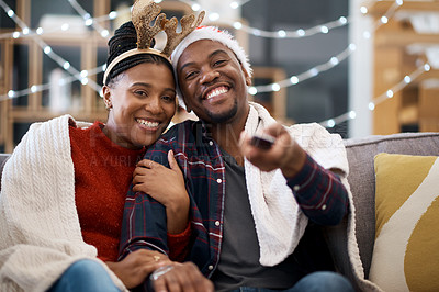 Buy stock photo Watching tv, couple and relax on a sofa for christmas show, movie or film in living room in a home. Love, tv and man with woman portrait on couch for festive celebration tv show, channel and surfing