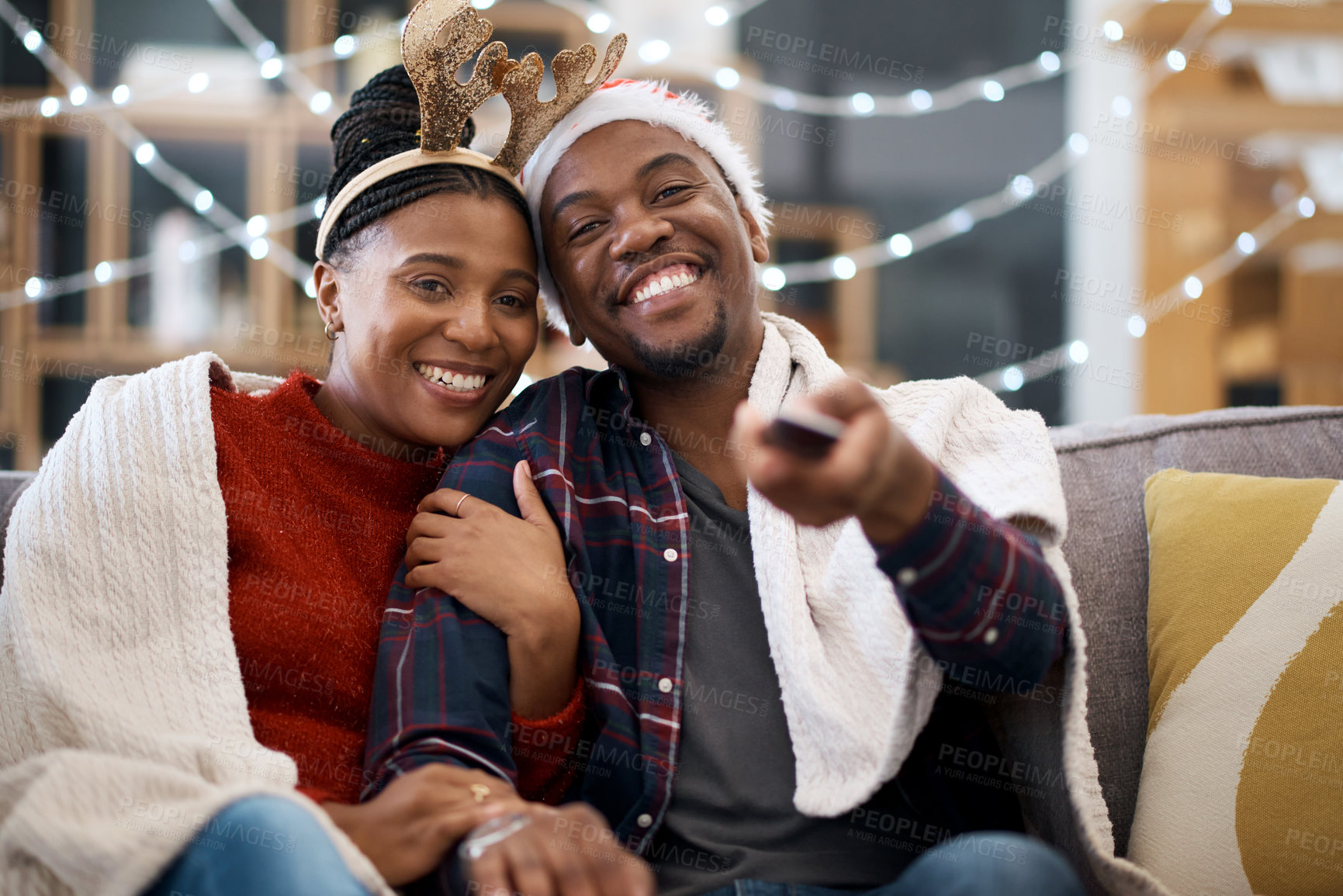 Buy stock photo Watching tv, couple and relax on a sofa for christmas show, movie or film in living room in a home. Love, tv and man with woman portrait on couch for festive celebration tv show, channel and surfing