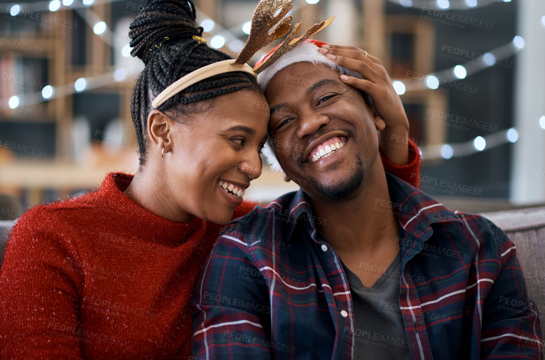 Buy stock photo Happy black couple, sofa and christmas in home living room together, sitting and celebration. Black woman, man and smile with holiday happiness, house and relax in lounge to celebrate in festive time