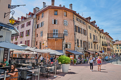 Buy stock photo Annecy, France, July, 17, 2019: Houses and street life in the famous medieval part of the city of Annecy, Department of Upper Savoy, France.