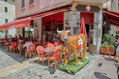 Buy stock photo Annecy, France, July, 17, 2019: Houses and street life in the famous medieval part of the city of Annecy, Department of Upper Savoy, France.