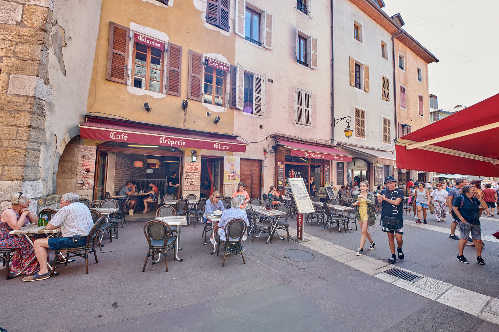 Buy stock photo Annecy, France, July, 17, 2019: Houses and street life in the famous medieval part of the city of Annecy, Department of Upper Savoy, France.