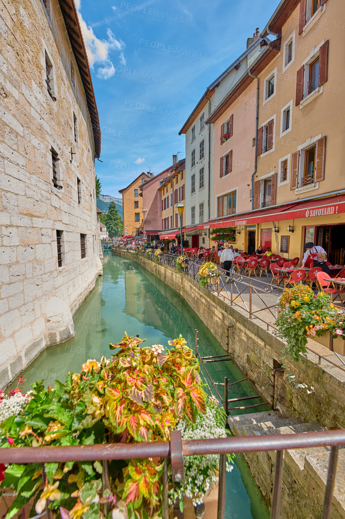 Buy stock photo Annecy, France, July, 17, 2019: Houses and street life in the famous medieval part of the city of Annecy, Department of Upper Savoy, France.