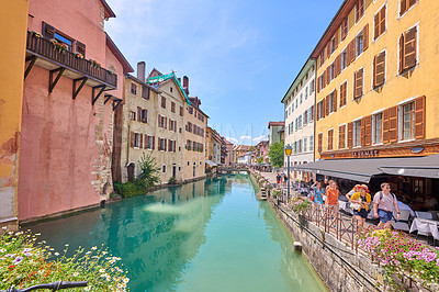 Buy stock photo Annecy, France, July, 17, 2019: Houses and street life in the famous medieval part of the city of Annecy, Department of Upper Savoy, France.