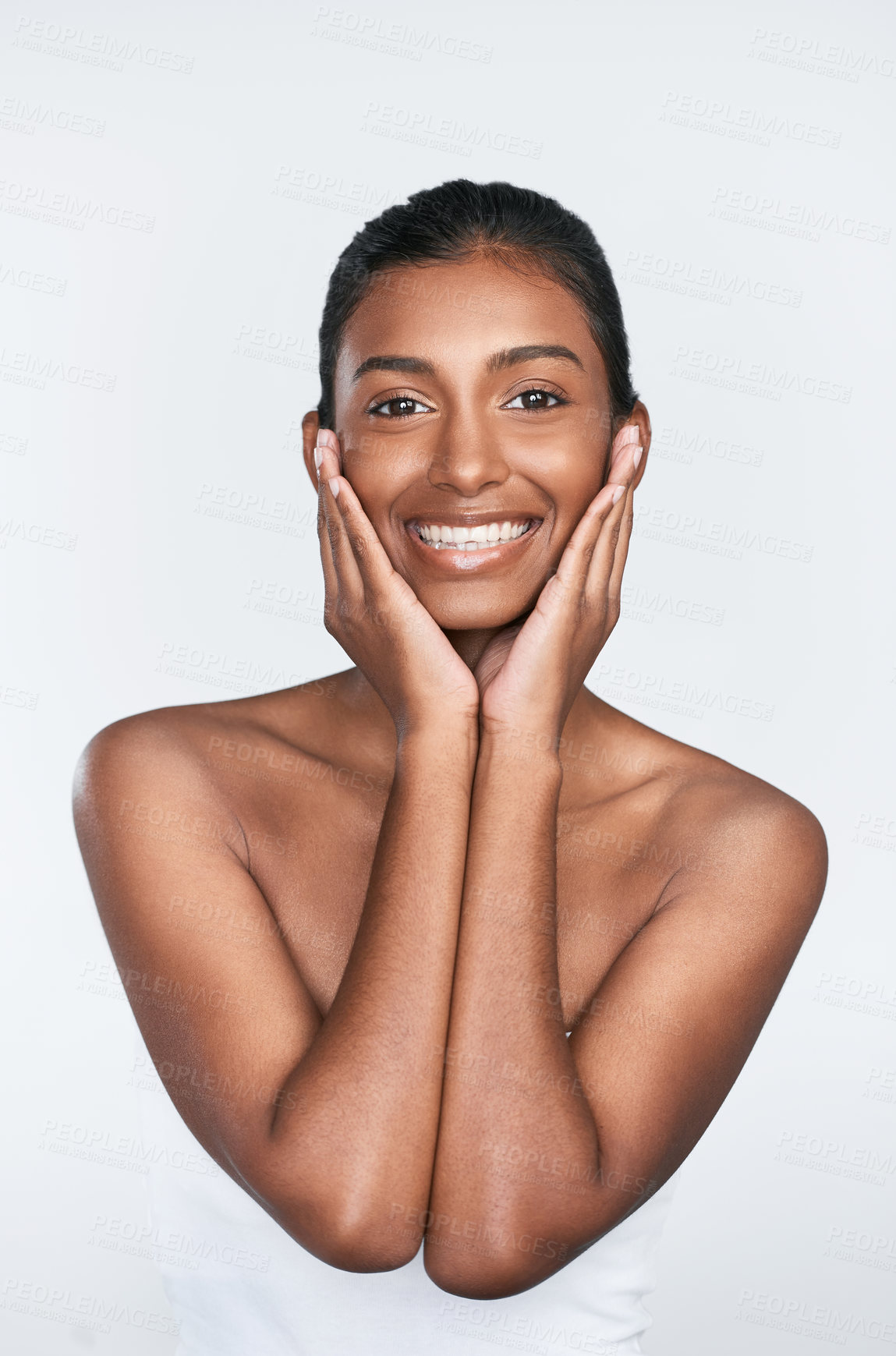 Buy stock photo Shot of a beautiful young woman posing against a white background