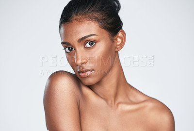 Buy stock photo Shot of a beautiful young woman posing against a white background