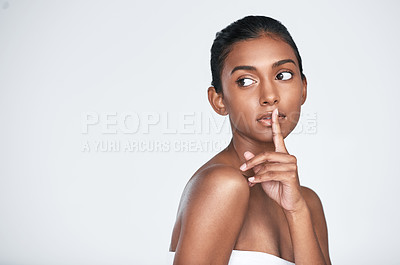 Buy stock photo Shot of a beautiful young woman posing against a white background