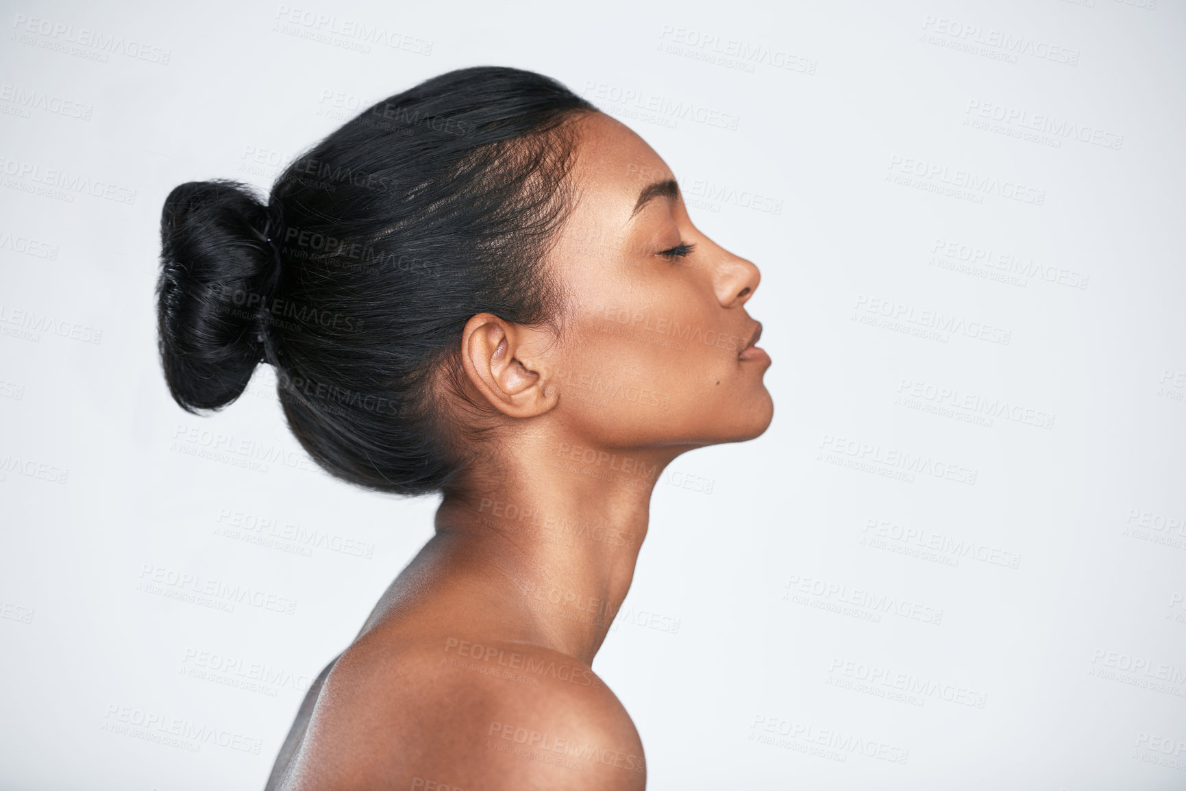 Buy stock photo Shot of a beautiful young woman posing against a white background