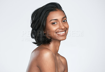 Buy stock photo Shot of a beautiful young woman posing against a white background