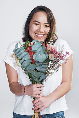 Buy stock photo Studio, gift and flowers with asian woman in portrait, surprise and present of plant for valentines day. Smile, female person and bouquet with floral bunch for anniversary, protea or white background