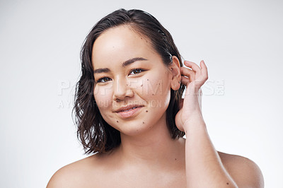 Buy stock photo Studio shot of a beautiful young woman posing against a white background