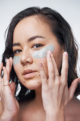 Buy stock photo Studio shot of a beautiful young woman wearing under-eye patches