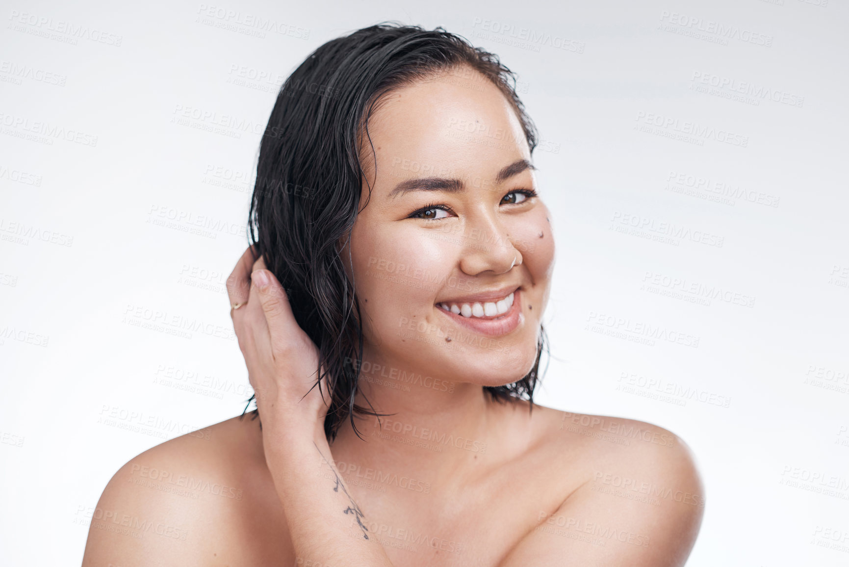 Buy stock photo Studio shot of a beautiful young woman posing against a white background