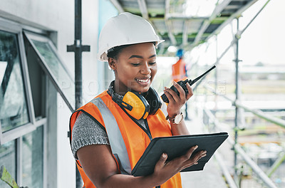 Buy stock photo Tablet, engineer and black woman worker planning on a construction site strategy and talking on a walkie talkie. Project management, infrastructure and female contractor doing building assessment