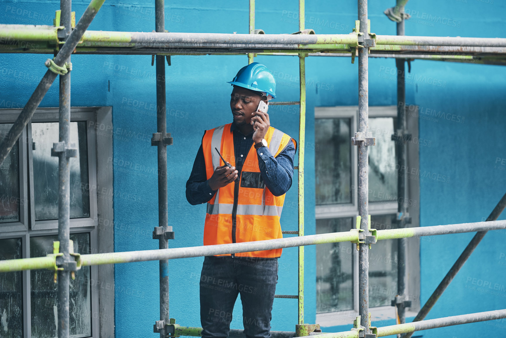 Buy stock photo Planning, construction and man on site with phone call, communication and architecture. Property developer, contractor or project manager at scaffolding on smartphone for civil engineering inspection