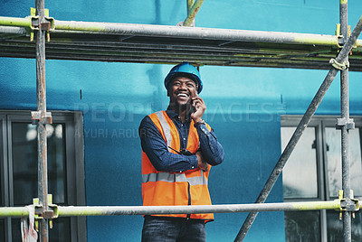 Buy stock photo Smile, construction and black man on site with phone call, communication and architecture. Property developer, contractor or project manager at scaffolding on smartphone for civil engineering plan