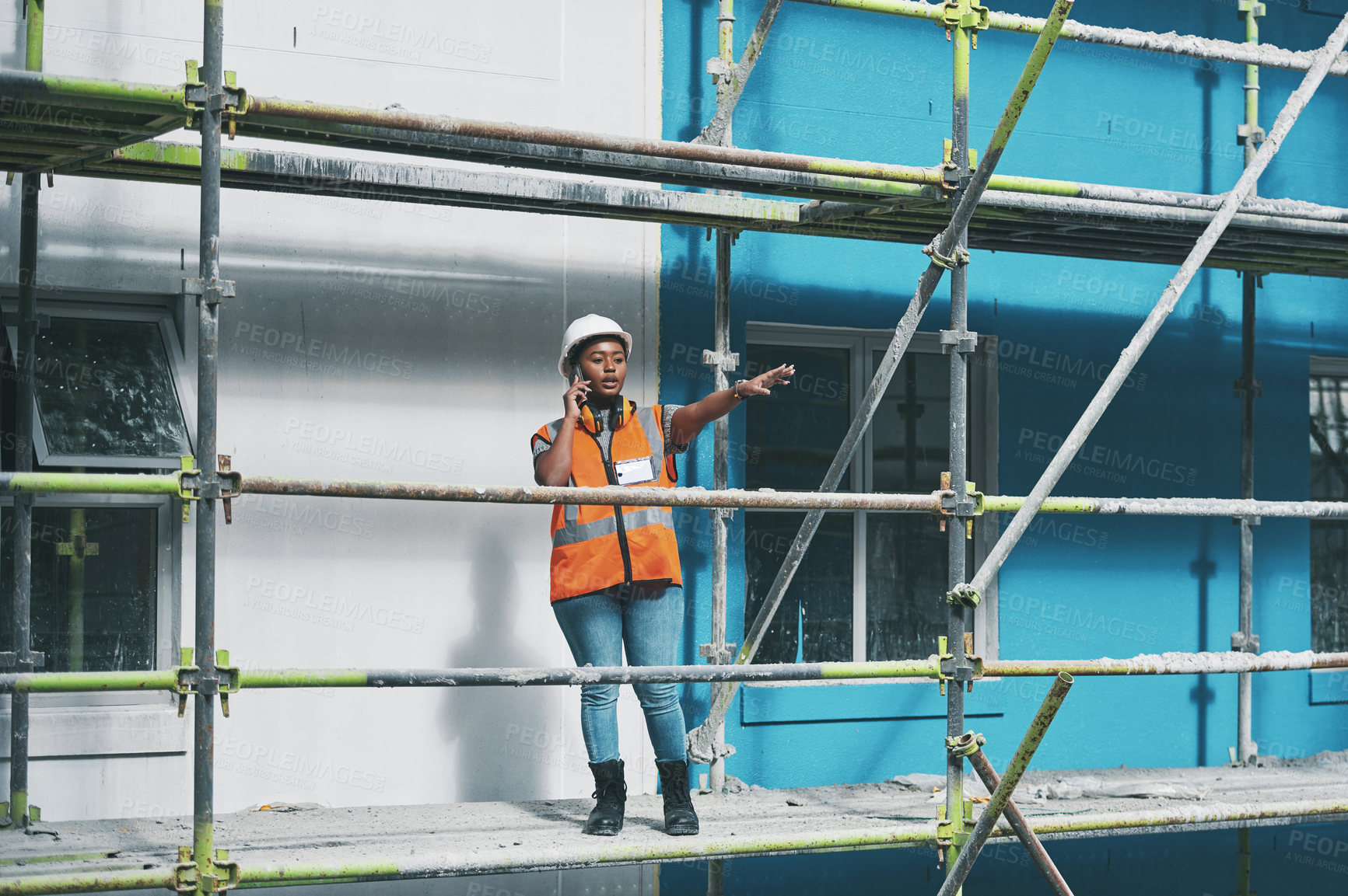 Buy stock photo Building, construction and black woman on site with phone call, communication and architecture. Property developer, contractor or project manager at scaffolding on smartphone for civil engineering