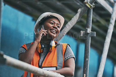 Buy stock photo Construction manager, contractor and engineer talking on a phone while planning logistics at a building site in town. Happy, smiling and cheerful young female architect, supervisor and city planner