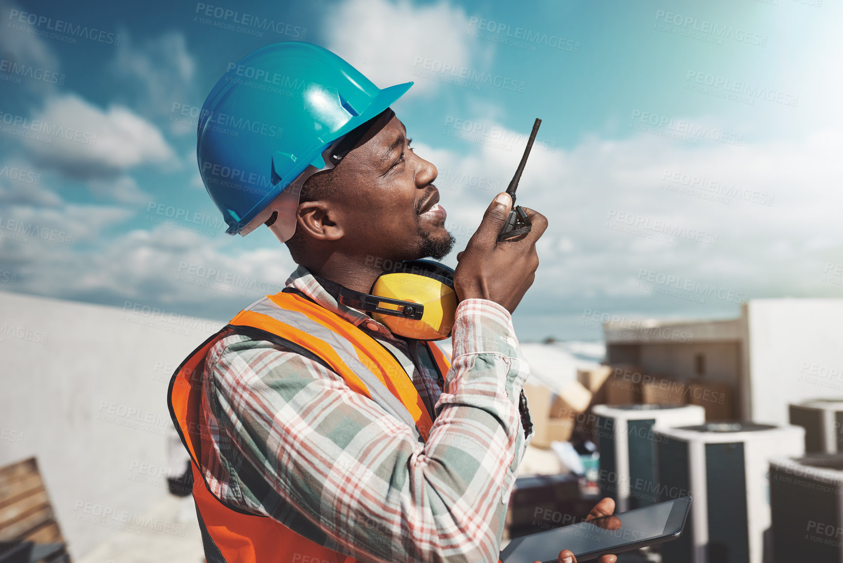 Buy stock photo Walkie talkie, black man and engineer with communication, construction and listening. African architect, radio and contractor planning industrial project, building maintenance and conversation