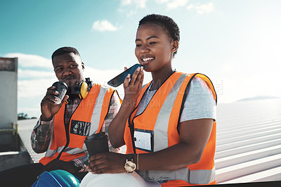 Buy stock photo Shot of a young woman using a smartphone on a coffee break at a construction site