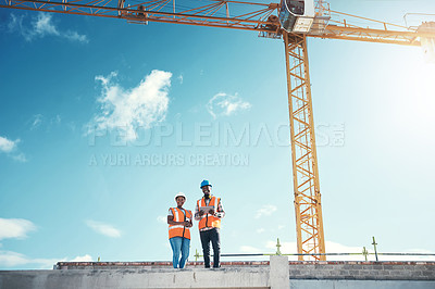 Buy stock photo Engineering, tablet and team on building roof at construction site for vision, development or architecture. Black woman and man outdoor for engineer project or safety inspection with sky mockup
