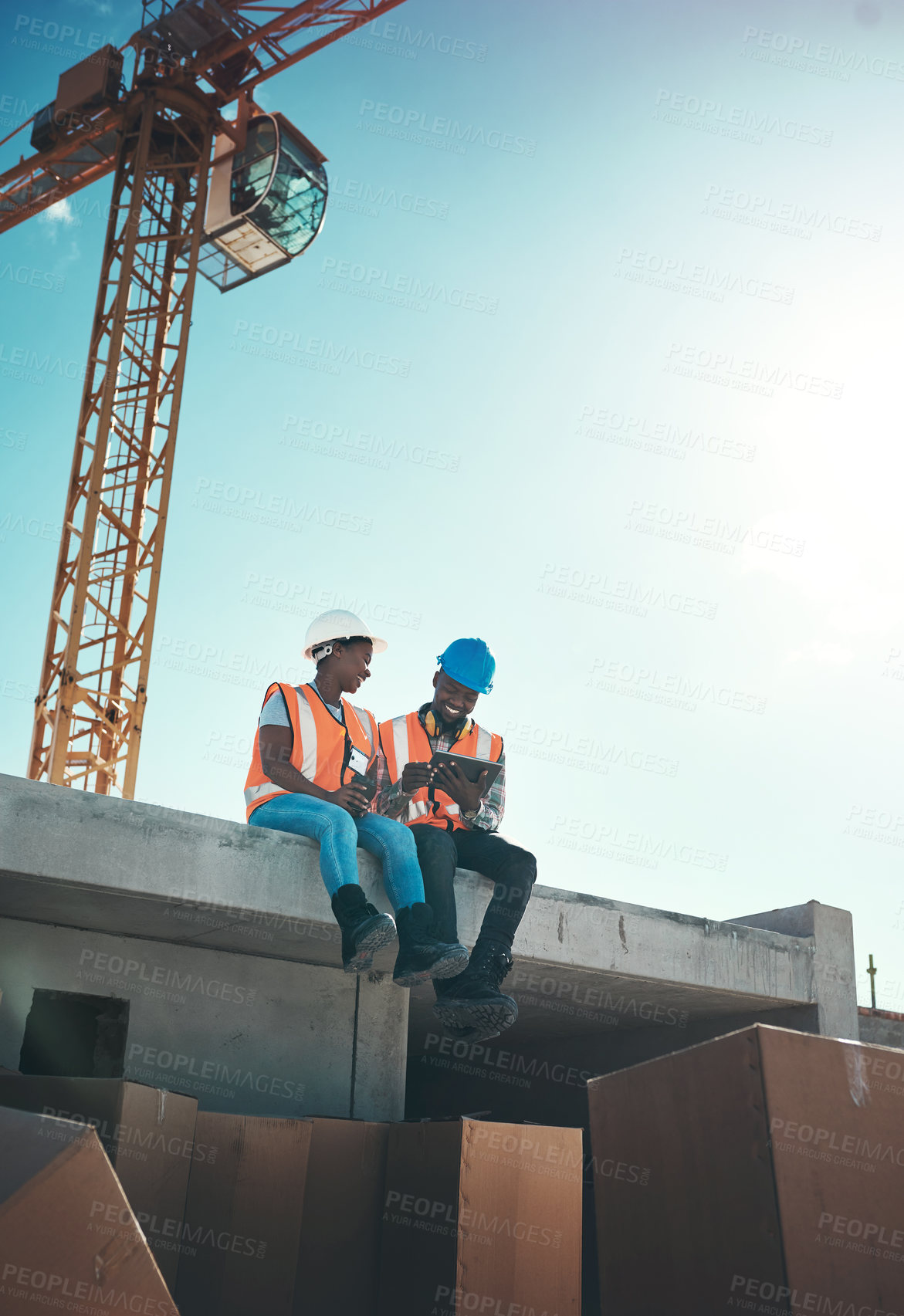 Buy stock photo Tablet, engineer and talking on building roof at construction site for vision, development or architecture. Black woman and man outdoor for engineering teamwork, mobile app or safety with sky mockup
