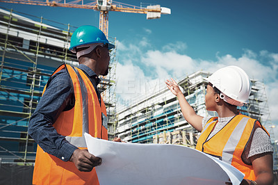 Buy stock photo Blueprint, engineer or architect team talking outdoor about building project, construction or architecture. Black woman manager and man together for engineering, planning or safety discussion in city