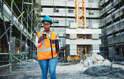 Buy stock photo Construction site, architecture and black woman with smartphone, typing and connection. African person, engineering or inspector with cellphone, safety and online reading with digital app or internet