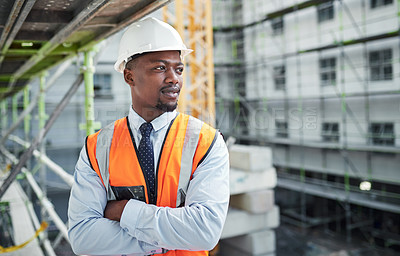 Buy stock photo Shot of a confident young man working at a construction site