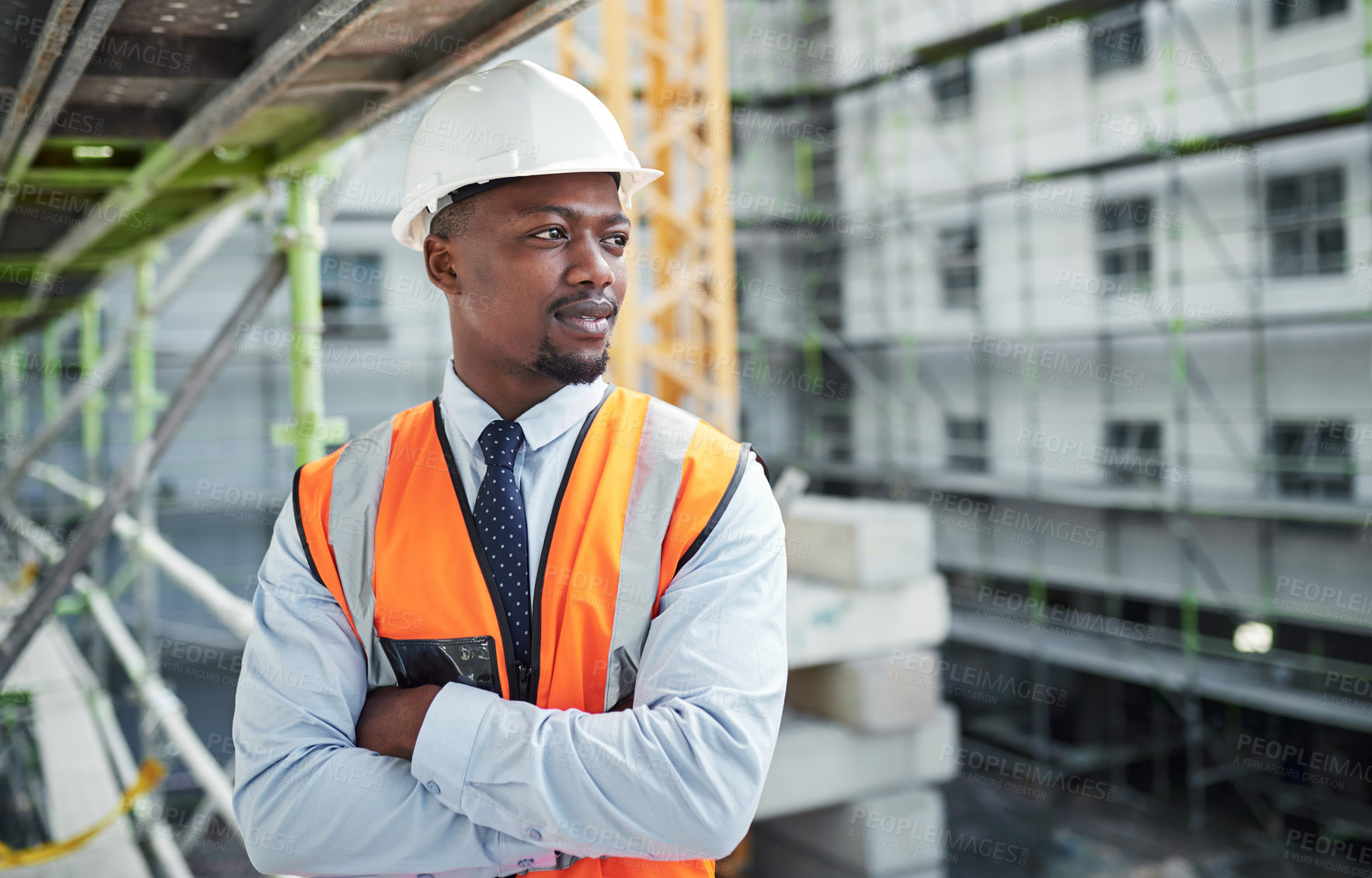 Buy stock photo Construction site, architecture and businessman with arms crossed for thinking, maintenance and inspection. Engineering, black person and manager with helmet for safety, development or building ideas
