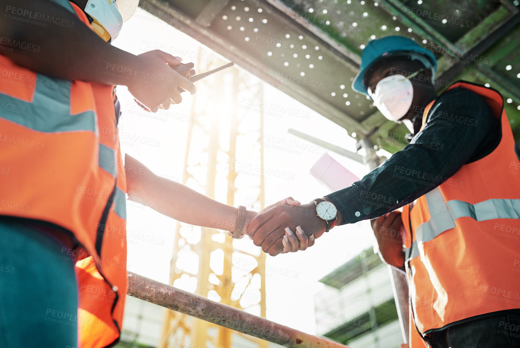 Buy stock photo Business people, civil engineer and handshake with colleague for partnership or agreement at construction site. Closeup, architect or employees shaking hands for deal, b2b or industrial teamwork