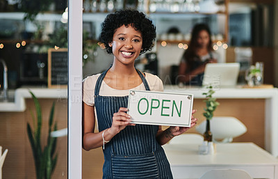 Buy stock photo Happy woman, open sign and portrait at cafe of waitress or small business owner for morning or ready to serve. African female person at restaurant holding board for coffee shop or cafeteria opening