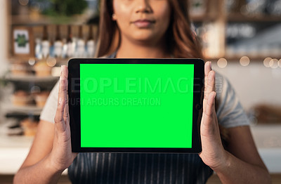 Buy stock photo Closeup shot of an unrecognisable woman holding a digital tablet with a green screen in a cafe