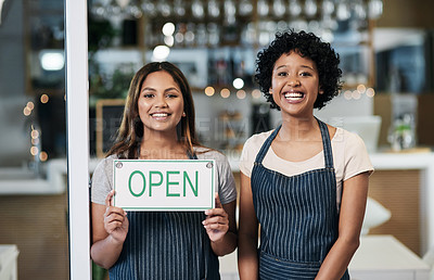 Buy stock photo Happy woman, open sign and portrait of cafe team in small business or waitress for morning or ready to serve. Women or restaurant servers holding board for coffee shop, store or cafeteria opening