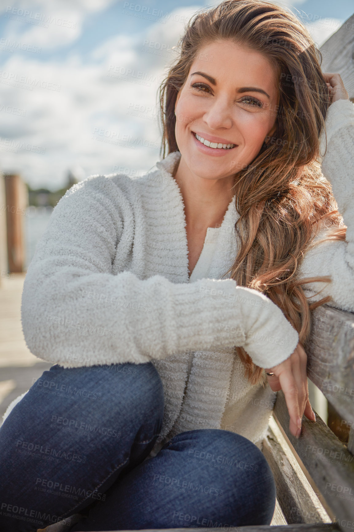 Buy stock photo Portrait of a beautiful young woman relaxing outdoors