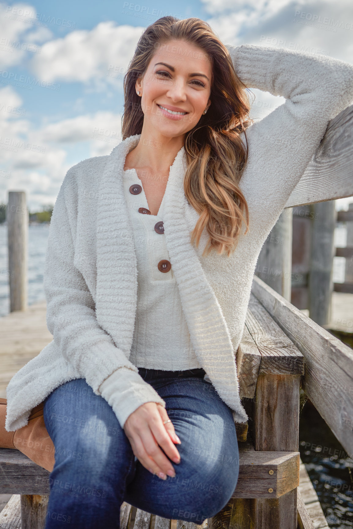 Buy stock photo Portrait of a beautiful young woman relaxing outdoors