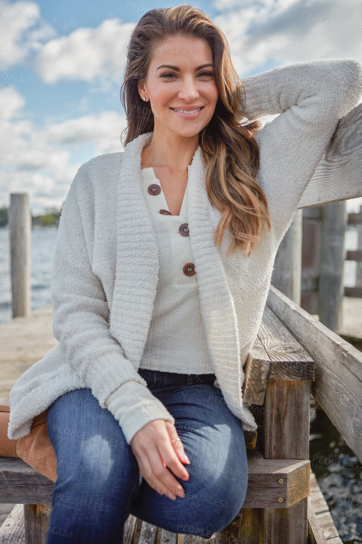 Buy stock photo Portrait of a beautiful young woman relaxing outdoors