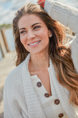 Buy stock photo Shot of a beautiful young woman relaxing outdoors