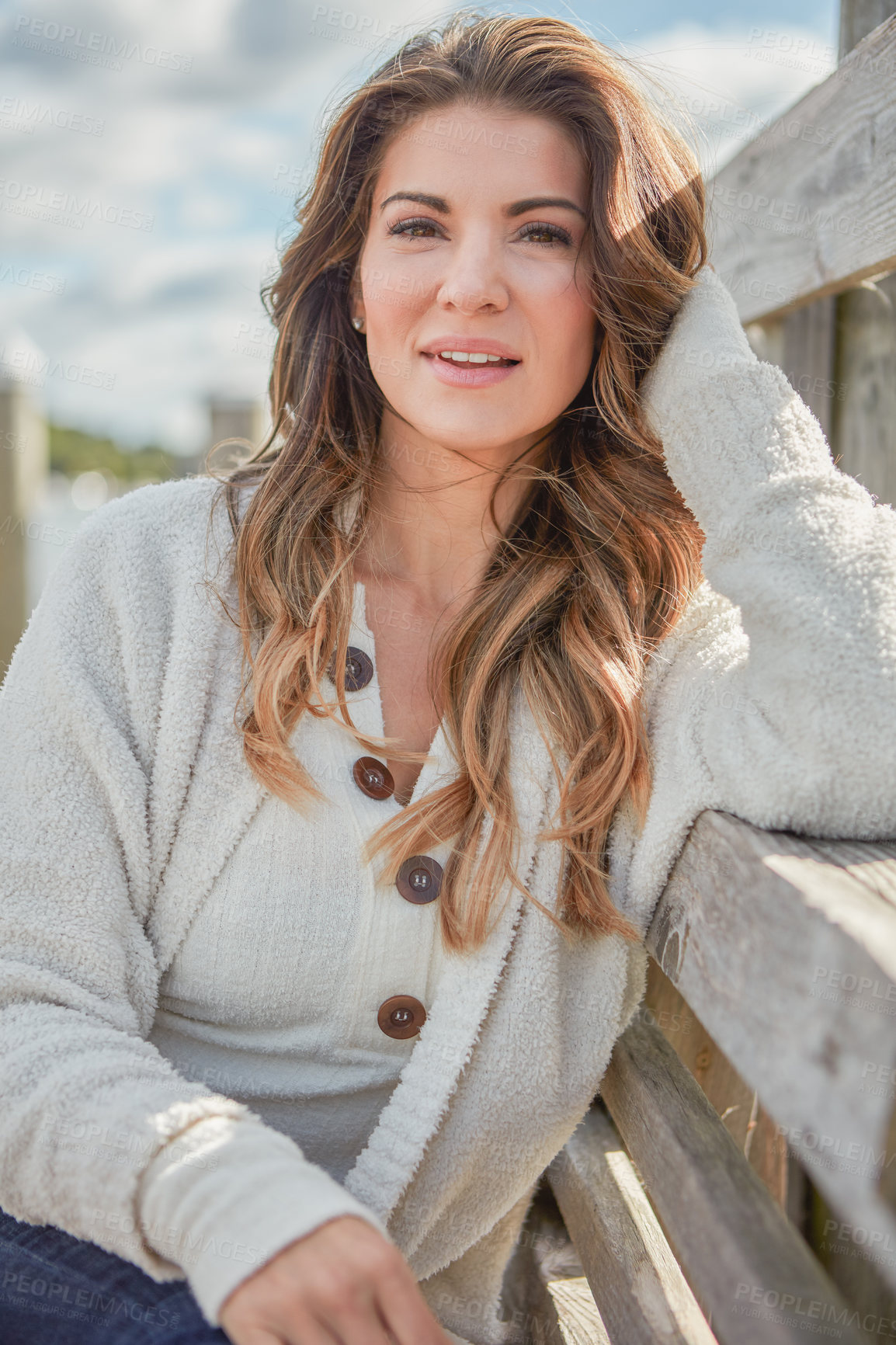 Buy stock photo Portrait of a beautiful young woman relaxing outdoors