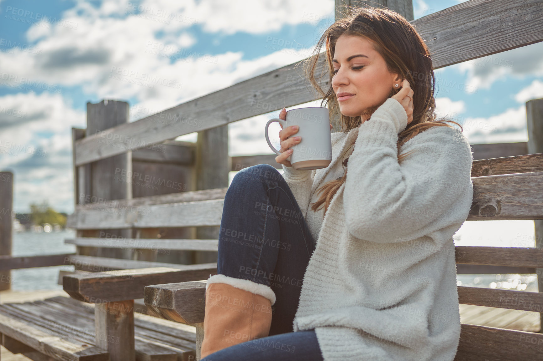 Buy stock photo Thinking, woman and bench with coffee outdoor with vision, caffeine and calm morning on holiday. Female person, stool and daydreaming with warm beverage on pier, nostalgia memory and vacation at lake
