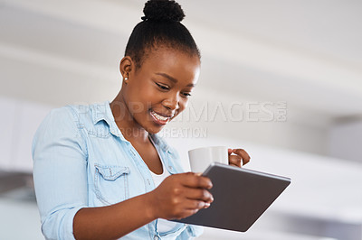 Buy stock photo Happy, tablet and black woman with coffee in kitchen in home reading online celebrity gossip blog. Smile, technology and African female person drinking cappuccino in morning on weekend at apartment.