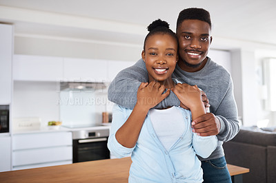 Buy stock photo Portrait, hug and black couple in kitchen, smile and relationship with love, romance and trust. African people, house and man with woman, embrace and marriage with happiness, joy and bonding together