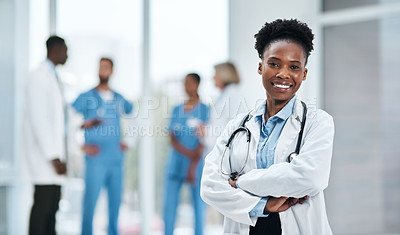 Buy stock photo Portrait of a young doctor standing in a hospital