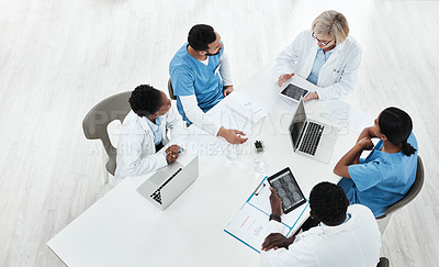 Buy stock photo High angle shot of a group of medical practitioners having a meeting in a hospital boardroom