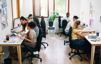 Buy stock photo Shot of a group of young businesspeople working together modern office