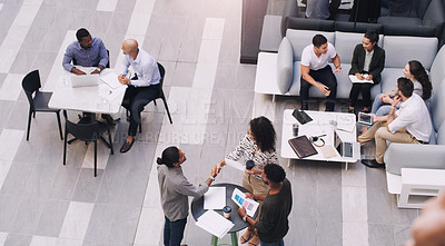 Buy stock photo Top view, businesspeople talking and meeting at a conference at their office space. Diversity at work, communication or collaboration and networking or event planning have a conversation together